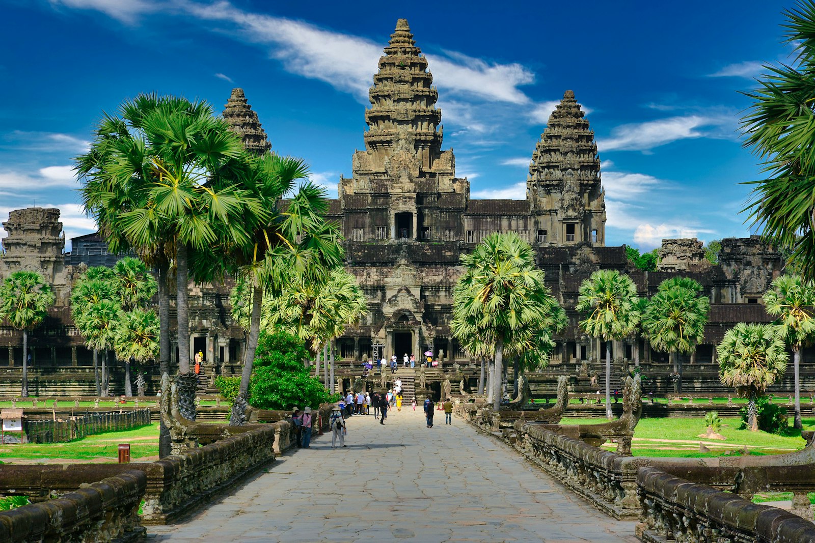 The temple of Angkor Wat with palms and stone causeway, Cambodia