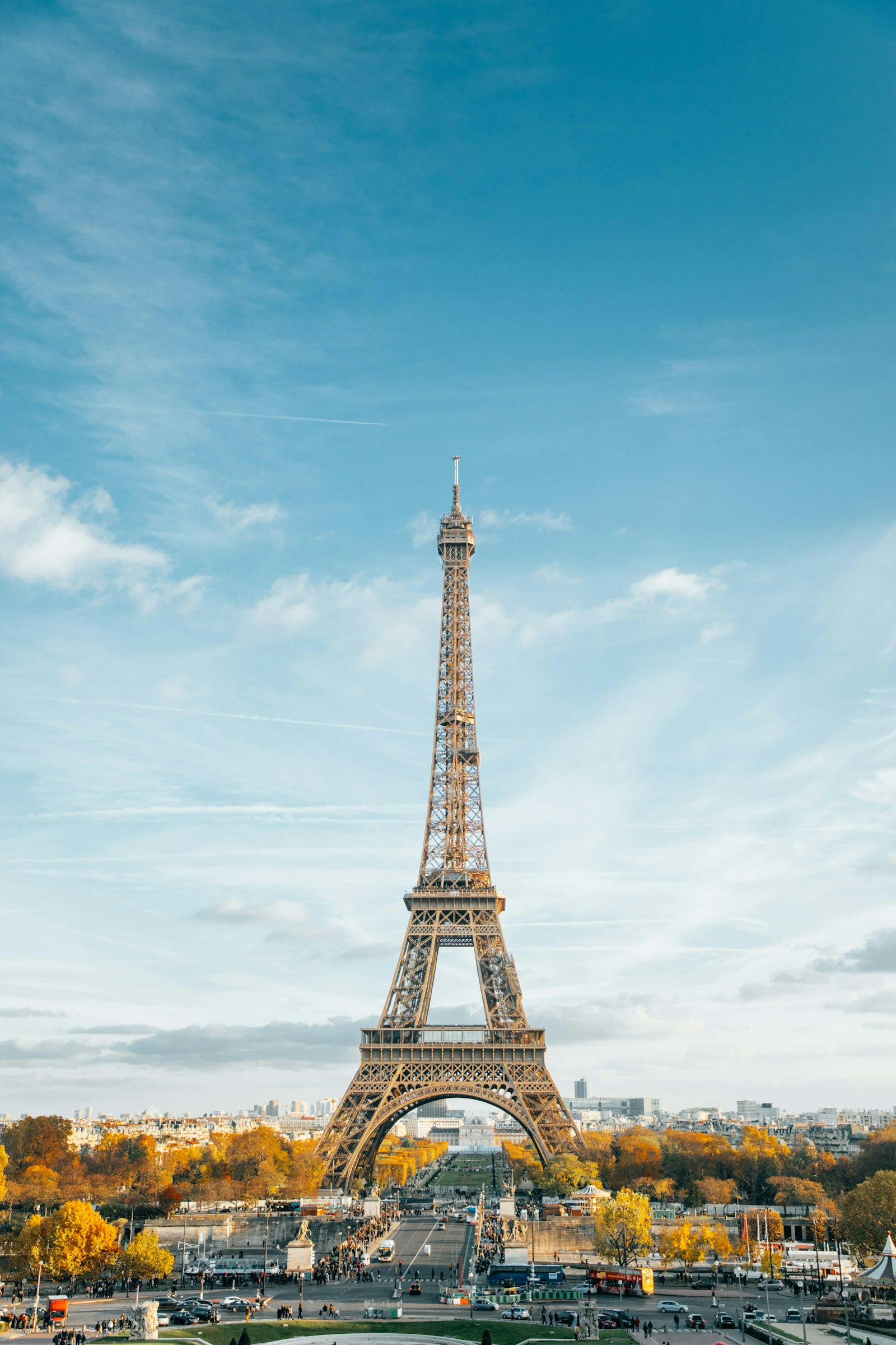 The Eiffel Tower in Paris with autumn trees and clear sky