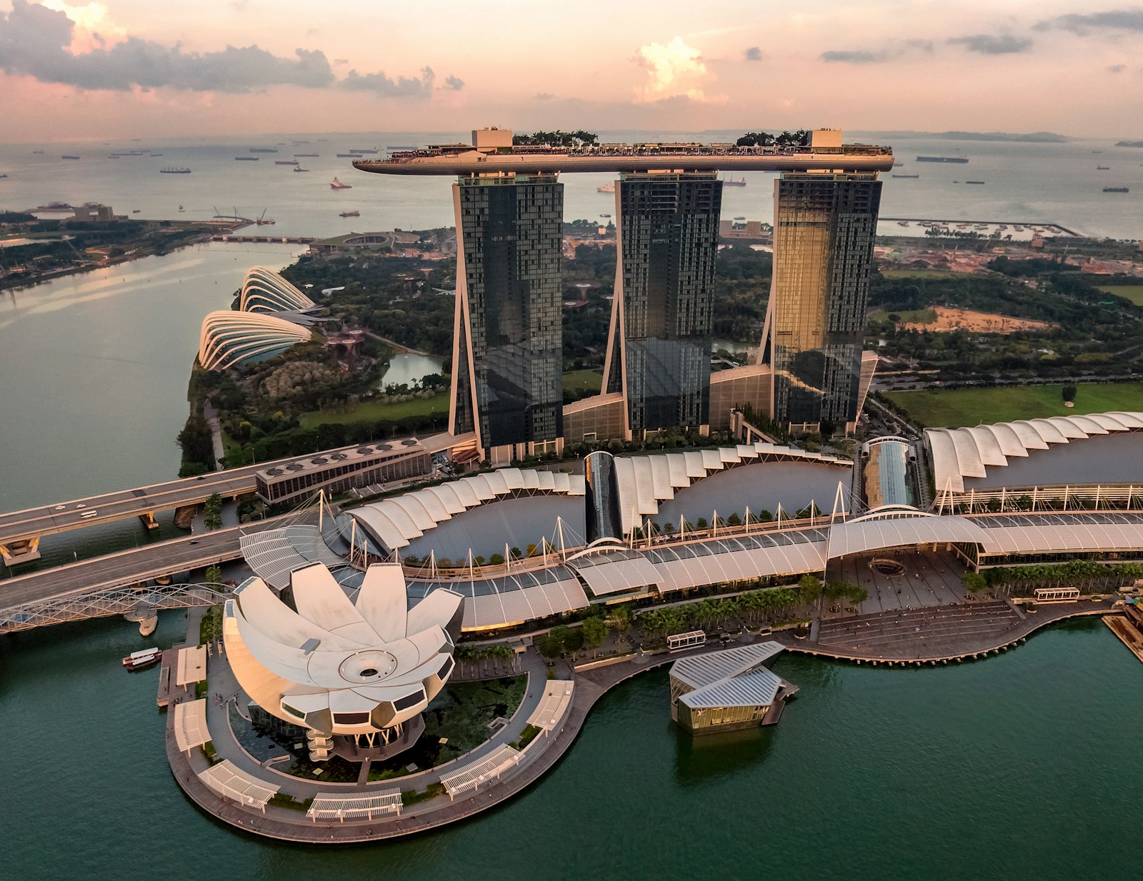 Aerial view of Marina Bay Sands and Gardens by the Bay at golden hour, Singapore